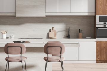 Stylish home kitchen interior with dining table and cooking space, closeup