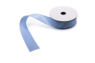 roll of blue ribbon on a white background