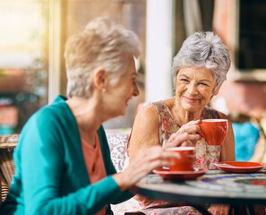 Senior women, friends and smile in cafe for coffee, bonding and retirement together with happiness. Elderly people, reunion and memory in restaurant for relax, conversation and wellness with tea