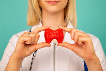 Female doctor holding anatomical model thyroid gland. Help and care concept