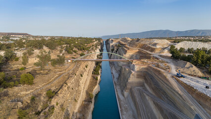 Corinth Canal, Greece. The Corinth Canal is a sluiceless shipping canal in Greece, connecting the Saronic Gulf of the Aegean and the Gulf of Corinth of the Ionian Sea, Aerial View