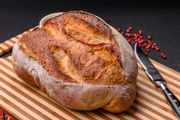 A loaf of brown bread with grains of cereals
