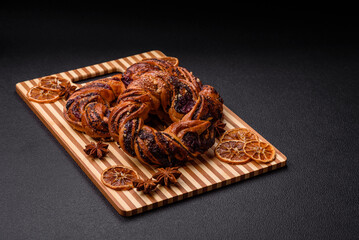 Delicious fresh baked bun with poppy seeds and berries