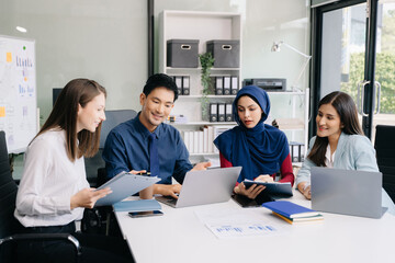 Multiracial group of young creative people in smart casual wear discussing business brainstorming meeting ideas design project.