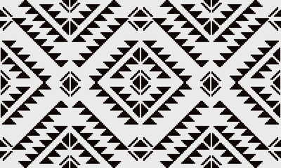 a fabric pattern composed of pixelated and white background designs