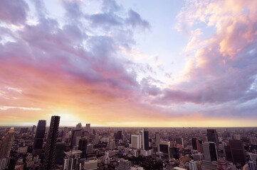 Fototapeta premium Sunset in megalopolis. Beautiful cityscape with top view on skyscrapers. Bangkok, Thailand.