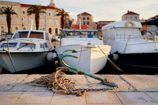 The anchore next to boad moored in harbor marine at Split waterfront promenade