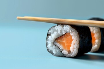 Close-up of Sushi Roll with Chopsticks