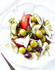Various olives on white wooden background. Close up. Copy space	