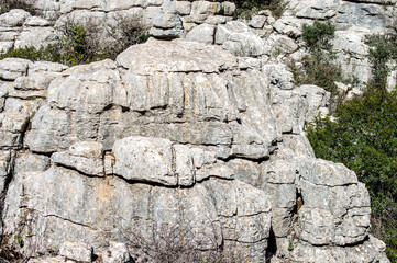 Hiking in the Torcal de Antequerra National Park, limestone rock formations and known for unusual karst landforms in Andalusia, Malaga, Spain.