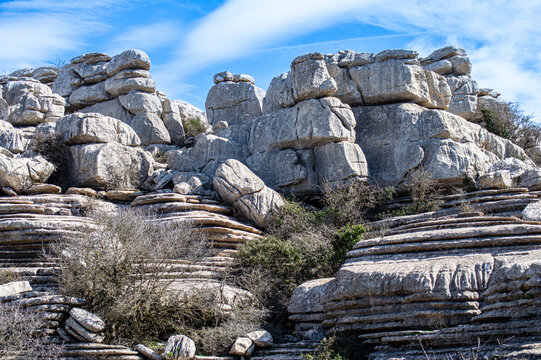 Hiking in the Torcal de Antequerra National Park, limestone rock formations and known for unusual karst landforms in Andalusia, Malaga, Spain.