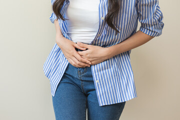 Flatulence asian young woman intolerance hand in stomach ache, suffer from food poisoning,...