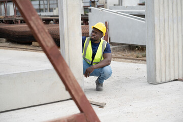 Portrait African engineer man or worker working with precast cement at precast cement outdoor...
