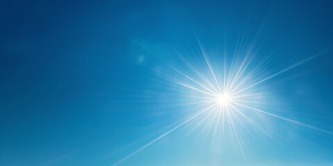 Obraz premium A dynamic sunburst against a pure blue backdrop, highlighting the sun's power and the purity of nature