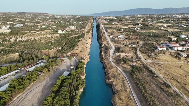 Corinth Canal, Greece. The Corinth Canal is a sluiceless shipping canal in Greece, connecting the Saronic Gulf of the Aegean and the Gulf of Corinth of the Ionian Sea, Aerial View