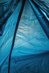 Inside view of a tent with camping gear and fabric walls