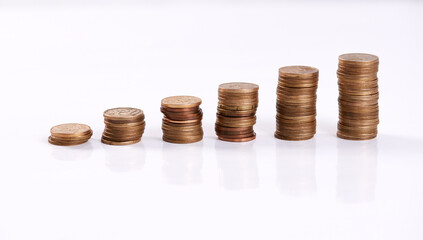 Money, coins stack and savings on table top for finance, investment and cash tips for budgeting progress. Change pile, counting rands or bank balance for economic recession, earnings or banking funds