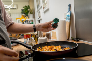 Chef at the kitchen preparing quesadillas with tofu and sweet corn