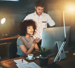 Creative, woman and man on computer at night office for information, research and collaboration for...
