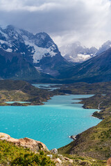 Lago Pehoe with Nordenskj&ouml;ld Lake and Paine River in the shadow of Cerro Paine Grande on a partly cloudy day