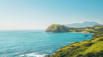 Fototapeta premium A stunning ocean vista featuring a verdant hill in the distance under a cloudless sky with tranquil waters