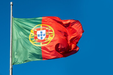 Portugal's national flag is waving in the sky © ednorog13