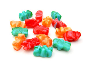 Handful of jelly bears on white background