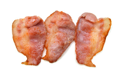 Stack cooked, crispy fried bacon isolated on a white background. Good for many health and cooking