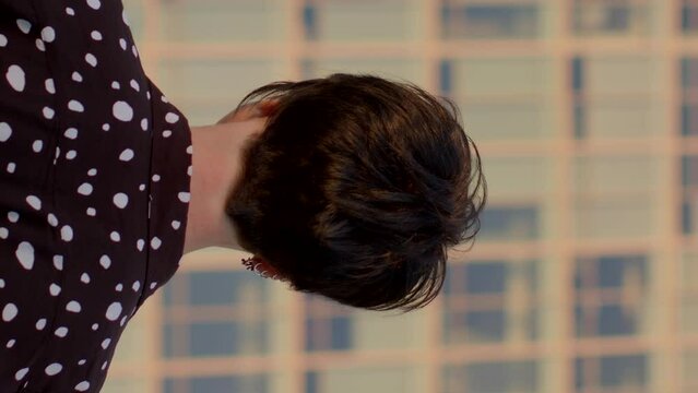 Vertical portrait of woman expert back. Trust and reliability, highlighting her expertise and credibility in a professional environment.