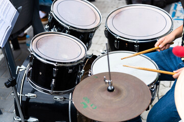 Female musician percussionist playing drums