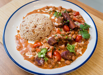 A vegetarian massaman curry in a bowl with sweet potato and many spices