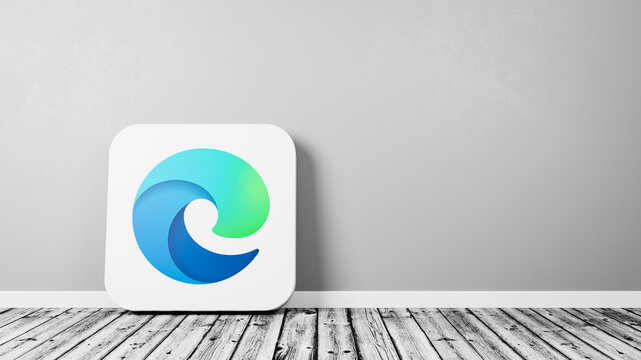Microsoft Edge App Icon on Wooden Floor Against Wall