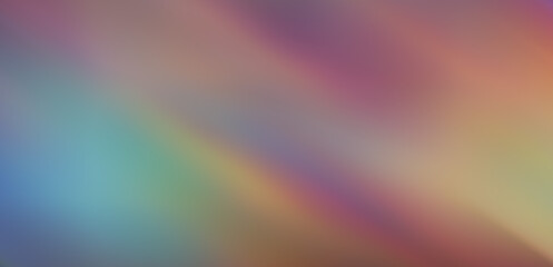Abstract blurred pastel grayish background with rainbow spots throughout the image.