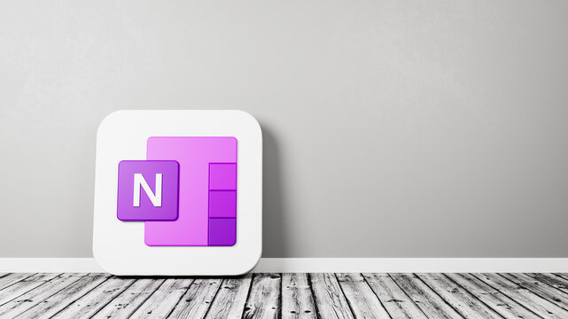 Microsoft OneNote App Icon on Wooden Floor Against Wall