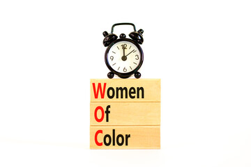 WOC women of color symbol. Concept words WOC women of color on beautiful wooden blocks. Beautiful...