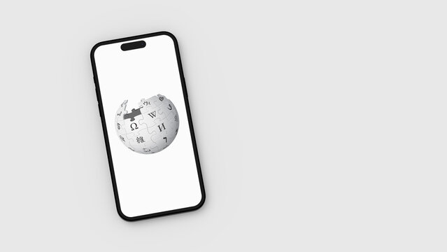 Wikipedia Logo on Mobile Phone Screen on Gray