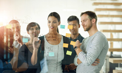 Glass, training and writing with business people in office together for coaching or planning....
