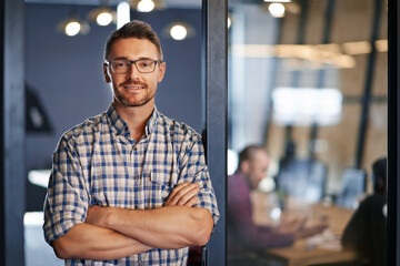 Portrait, business and man confident in office with ideas, planning and information of startup company. Male person, pride and arms crossed for solution, brainstorming and research of project