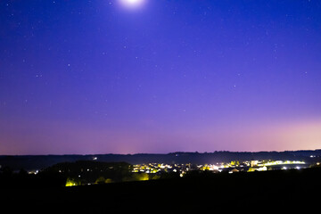  Nightsky with Stars, Moon, and Aurora, Northern Lights over Leiblfing Lower Bavaria Germany.