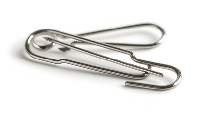 silver paper clip isolated on white background ,metal clip in whitebackground ,A single metal paper clip isolated on a white background