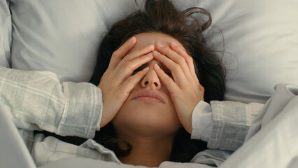 Close up Caucasian young woman touching grabbing face head hands headache migraine feeling illness...