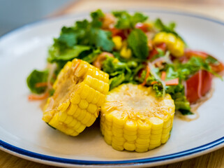 Spicy glass noodle salad on the white plate