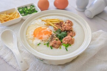 Congee or rice porridge with pork and eggs, thai food, asian food, chinese food