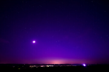 Nightsky with Stars, Moon, and Aurora, Northern Lights over Leiblfing Lower Bavaria Germany.