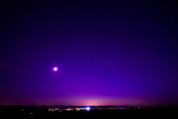 Nightsky with Stars, Moon, and Aurora, Northern Lights over Leiblfing Lower Bavaria Germany.