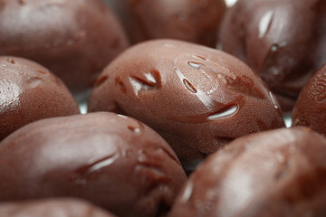 Chocolate candies. A pile of melting chocolate candies close-up. Selective focus