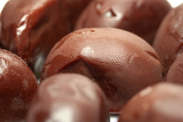 Chocolate candies. A pile of melting chocolates