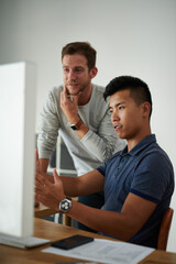 Men, asian designer and discussion at table with computer, development and collaboration in office....