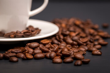 Close up of espresso cup with coffee beans