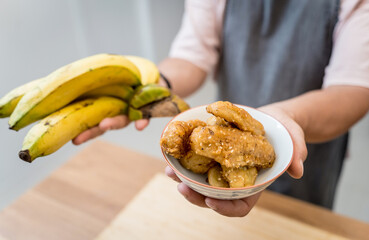 Crispy fried bananas in the small white bowl